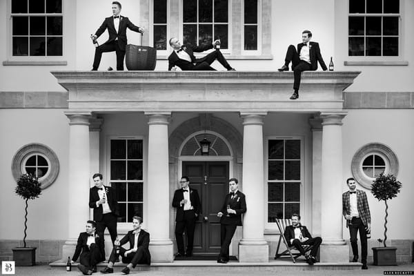 Groomsmen posing at entrance to wedding venue - Picture by Alex Beckett Photography