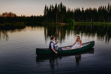 Bride and groom in rowing boat on lake - Steve Gerrard Photography