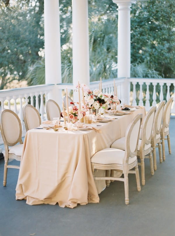 Wedding table with peach tablecloth