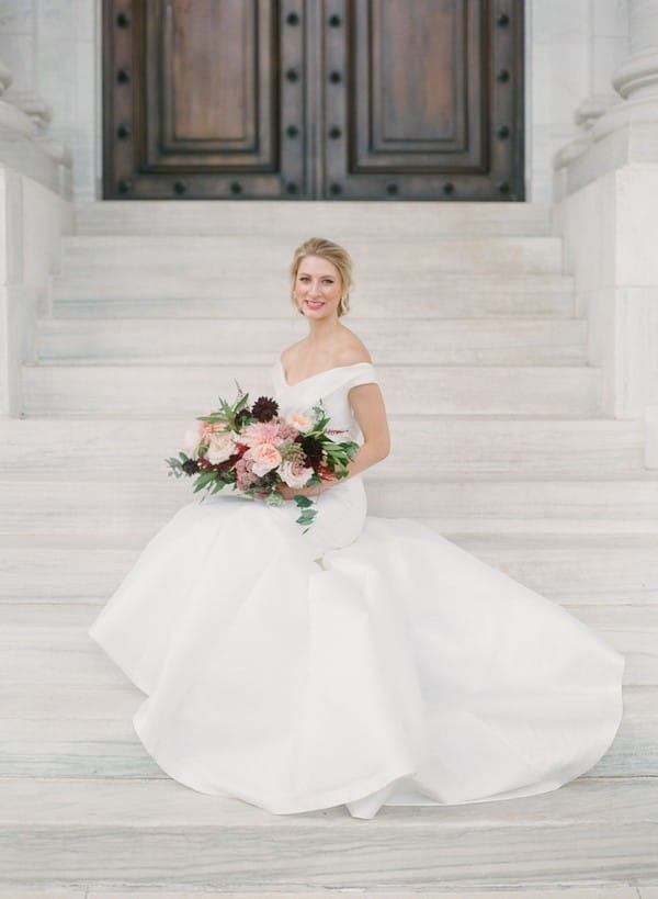 Bride sitting on steps of DAR, Washington