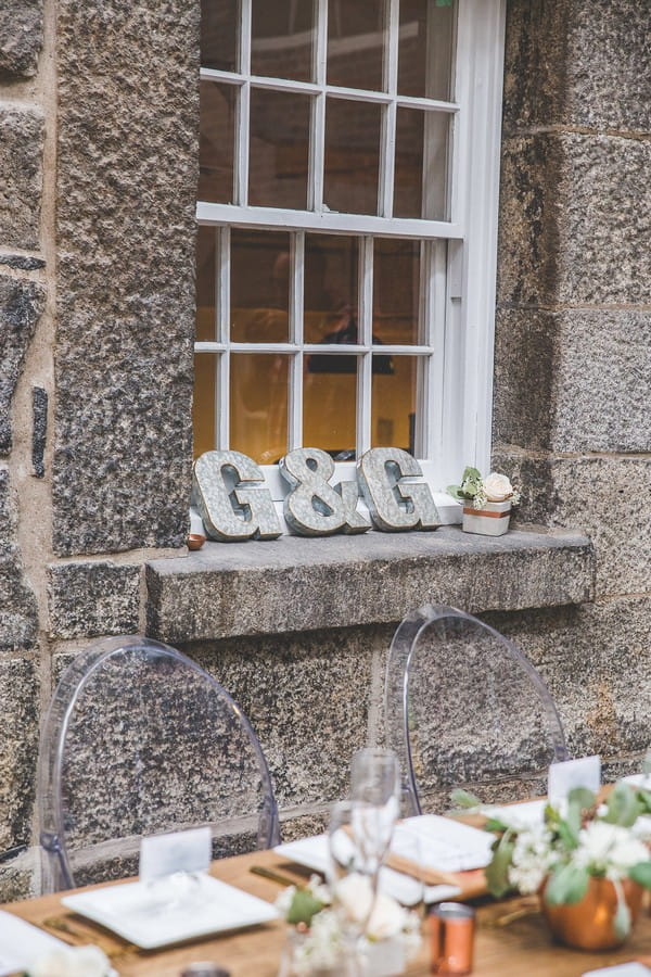 Bride and groom's initials on window ledge