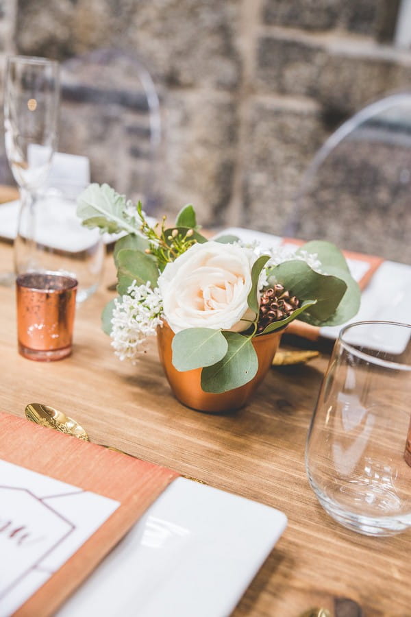 Wedding table flowers in copper pot