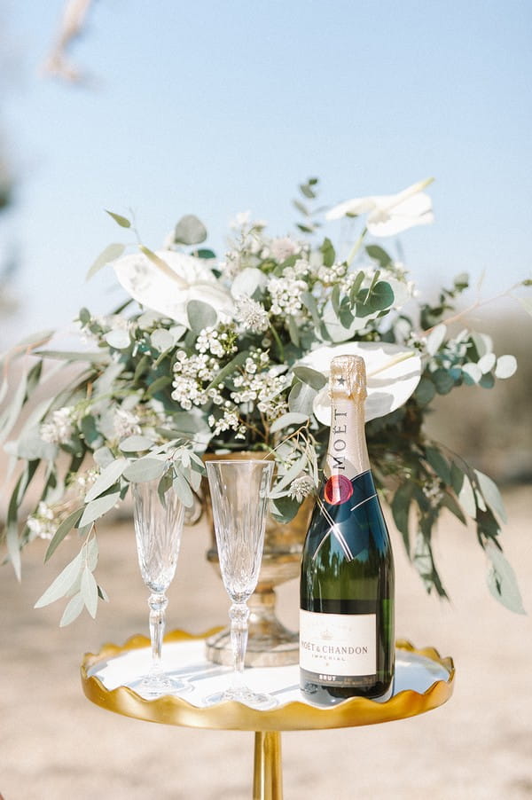 Bottle of Champagne on small wedding table