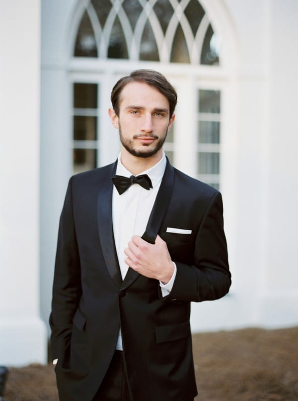 Groom in black tux and bow tie