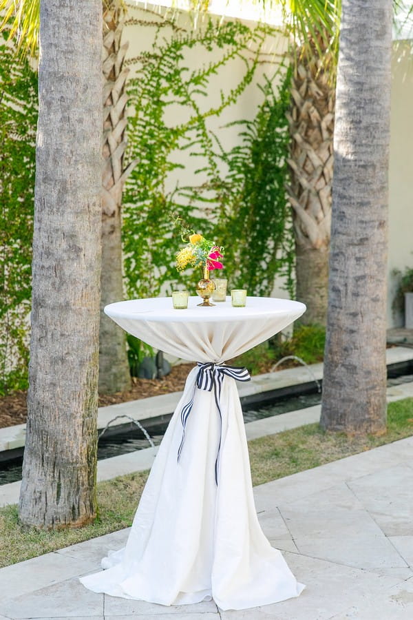 Small vase of flowers on table at wedding