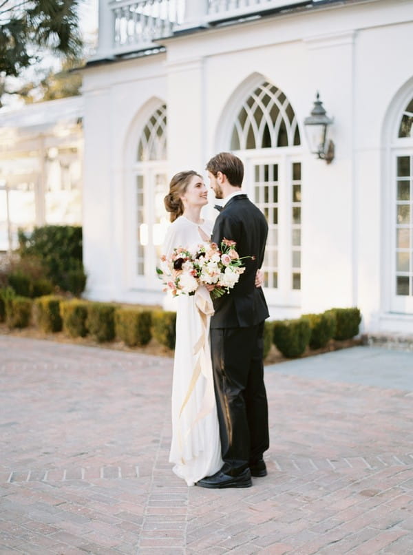 Bride and groom outside Lowndes Grove Plantation