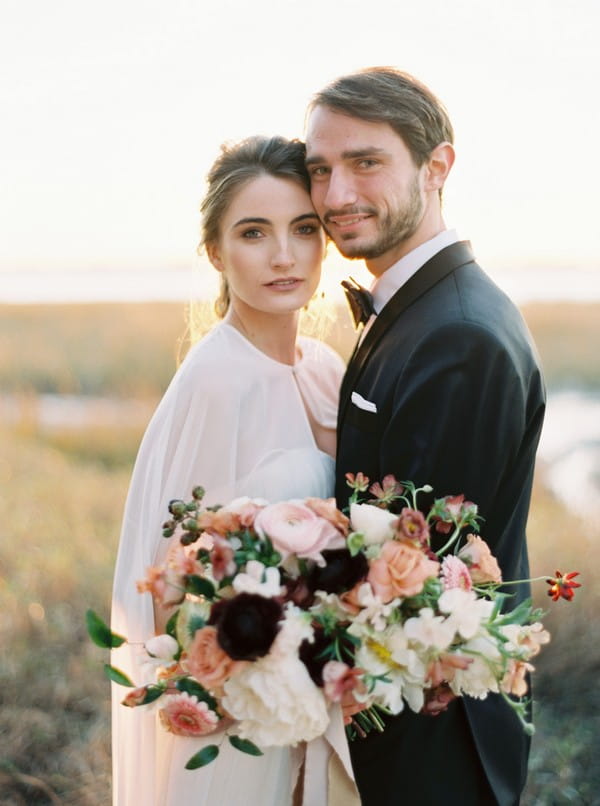 Bride and groom touching heads