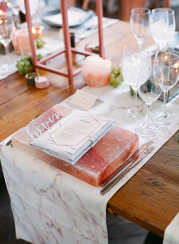 Slab of pink Himalayan salt at wedding place setting