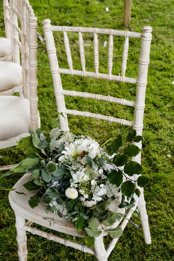 Bridal bouquet with lots of foliage on chair