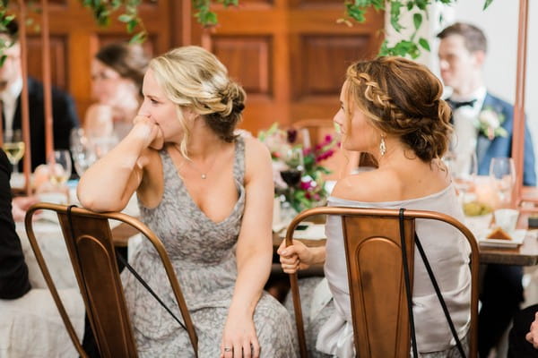 Bridesmaids listening to speech