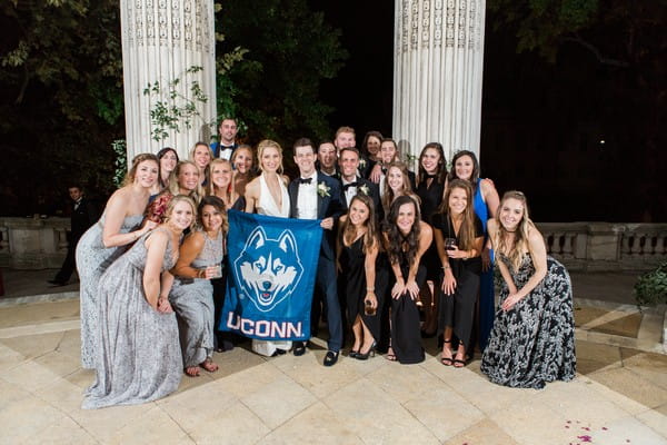 Wedding party with UCONN flag