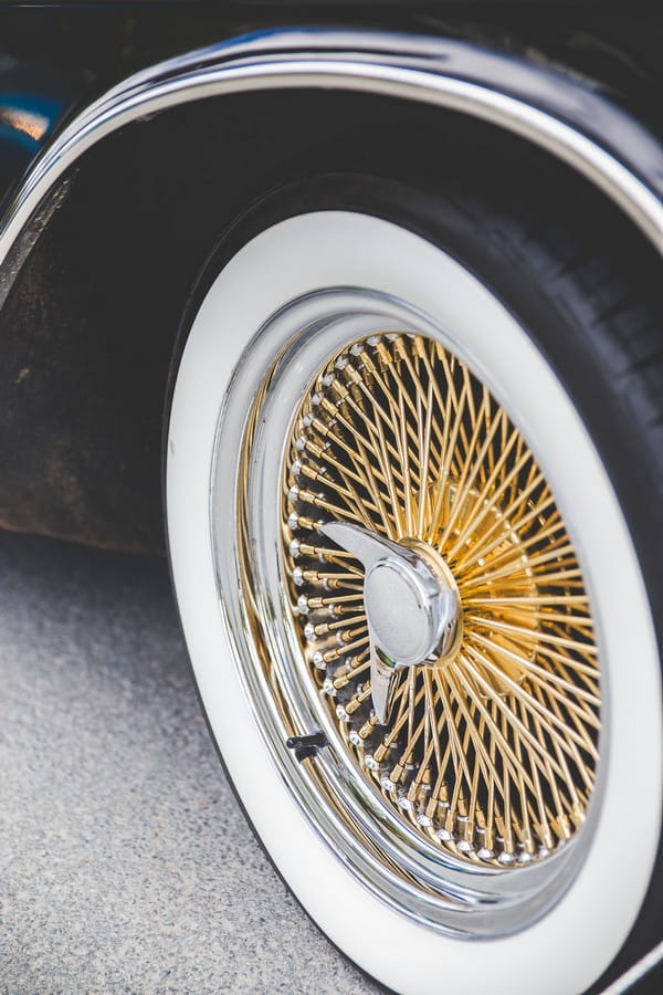 Copper spokes on wheel of Cadillac