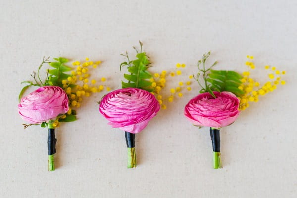 Bright pink flower buttonholes