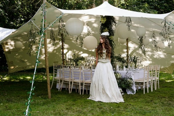 Bride standing by stretch tent at Cosawes Barton