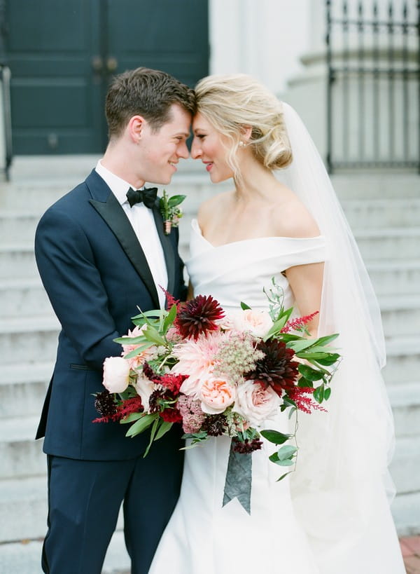 Bride and groom touching heads