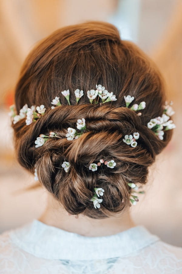 Twisted Bun Bridal Hairstyle with Flowers