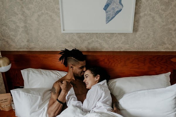 Couple in bed before elopement