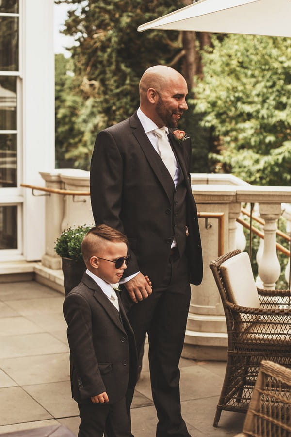 Groom with son before wedding at Coworth Park
