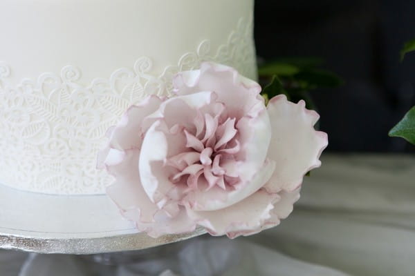 Sugar peony on white wedding cake