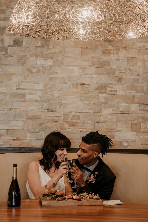 Bride and groom toasting with champagne