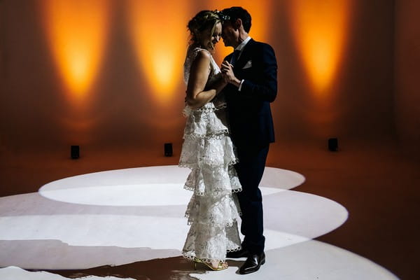 Bride and groom dancing in spotlight at wedding - Picture by Kristian Leven Photography