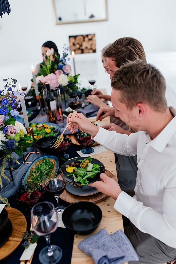 Wedding guests helping themselves to sharing food