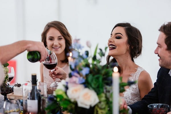 Bride being poured wine