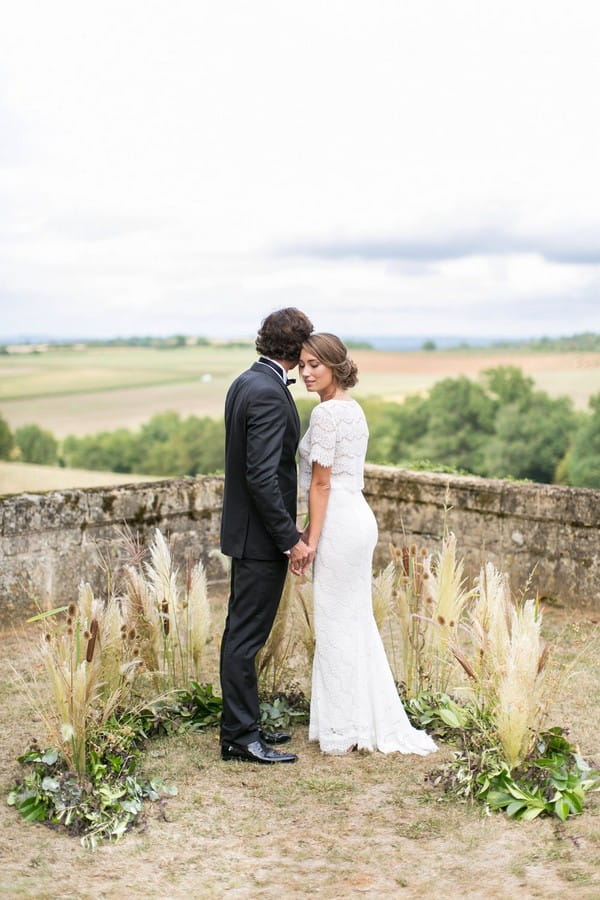 Bride and groom standing with views of Dordogne