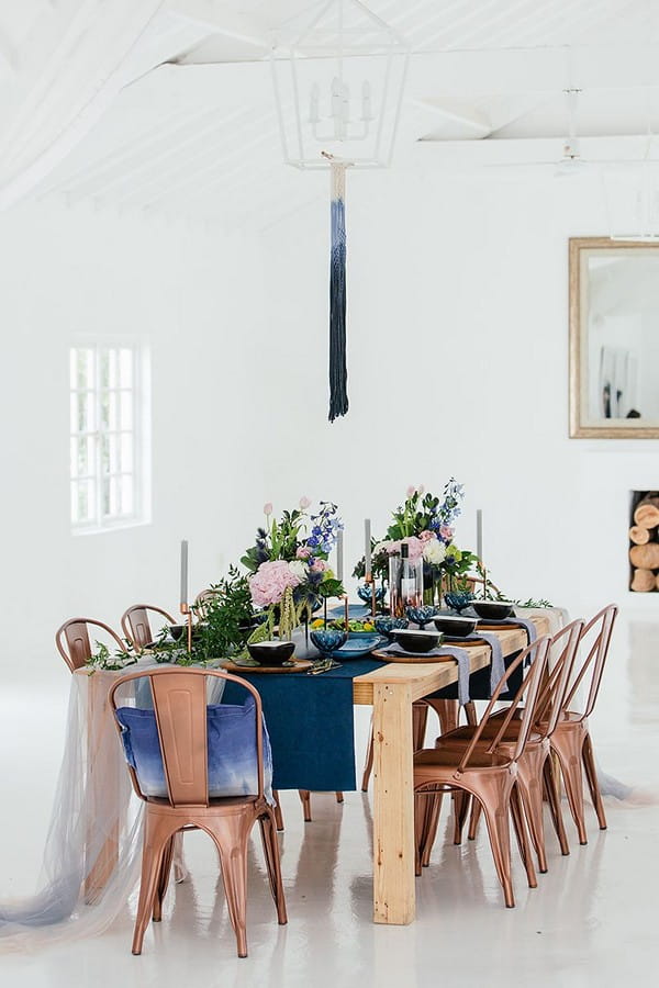 Table with blue and copper wedding styling