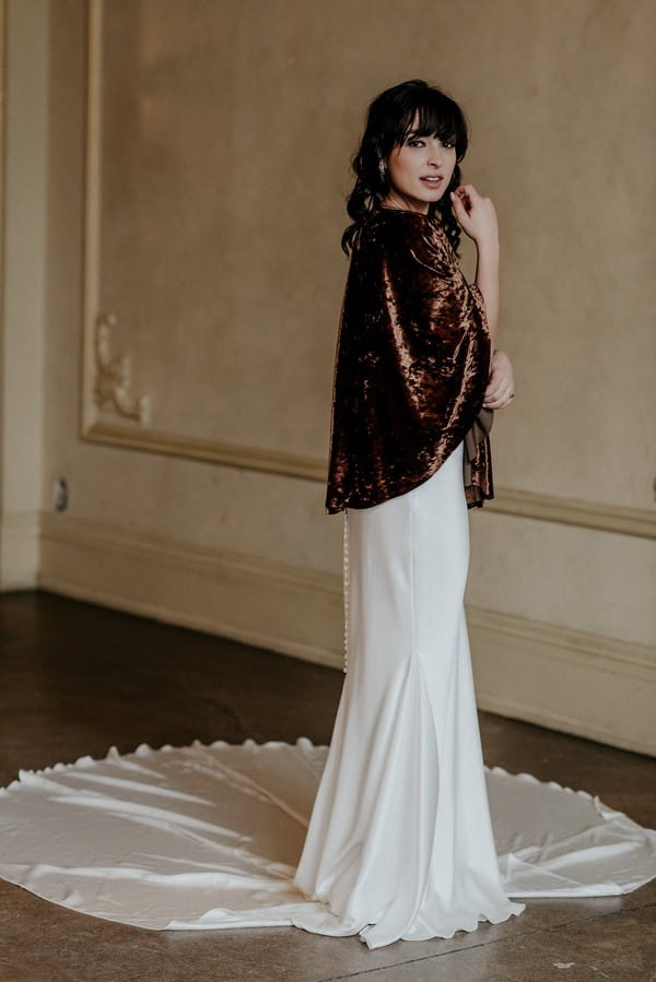 Bride wearing velvet shrug