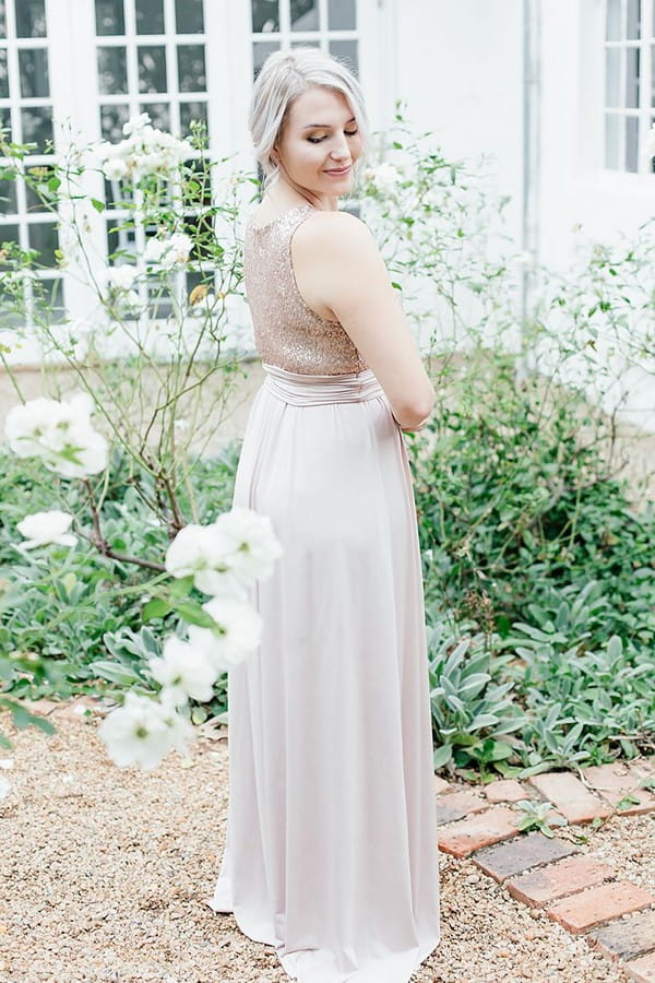 Bridesmaid wearing dress with sequinned top and tulle skirt