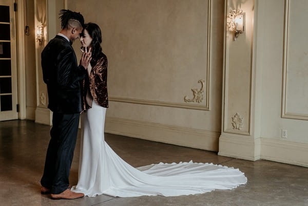 Bride and groom touching heads