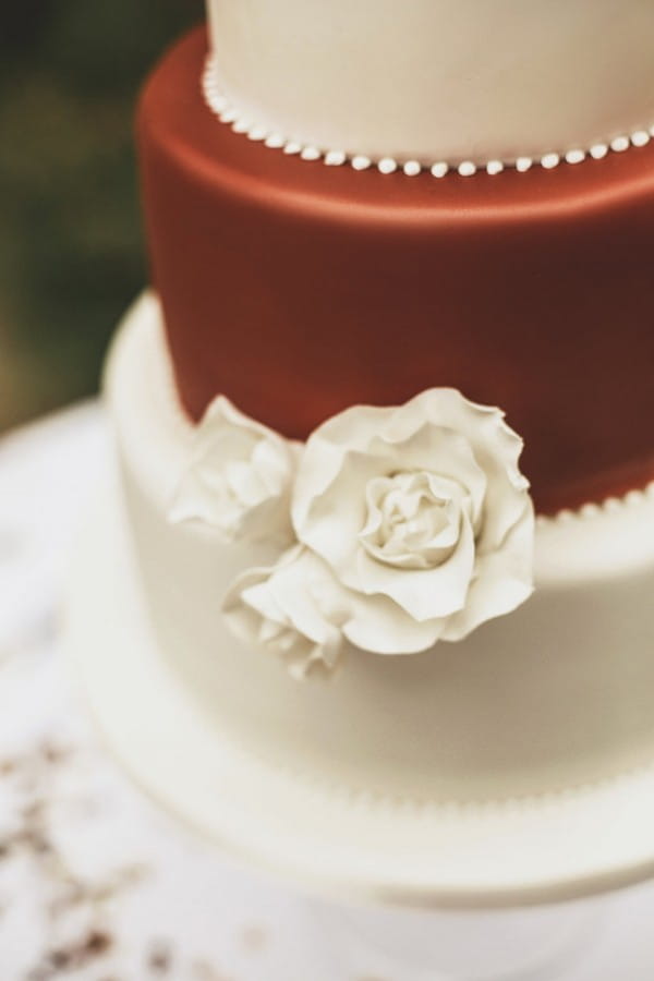 Sugar flower on ivory and copper wedding cake