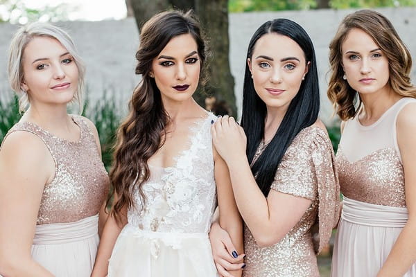 Bride with bridesmaids in sequinned detailed dresses