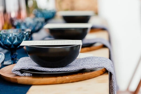 Black bowls on blue patterned napkins