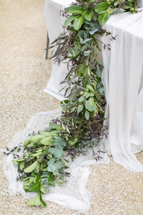 Foliage wedding table runner trailing off table