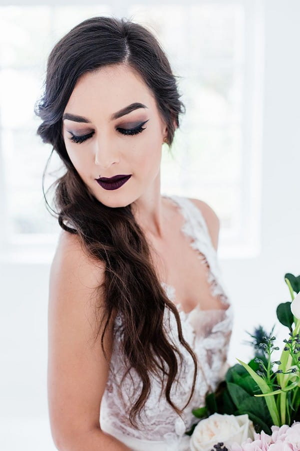 Bride with dark make-up and ponytail hairstyle