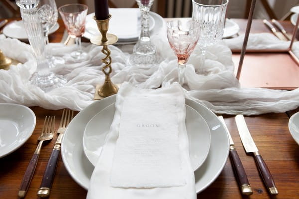 Simple white wedding place setting