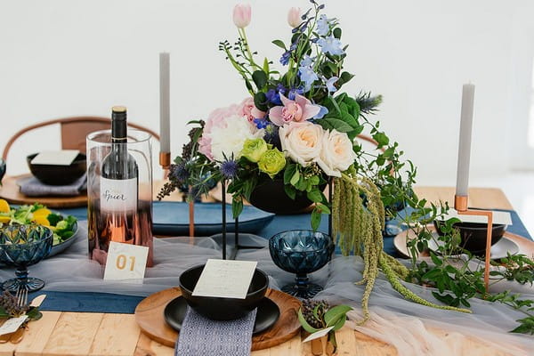 Wedding table with blue and copper details and winter flowers