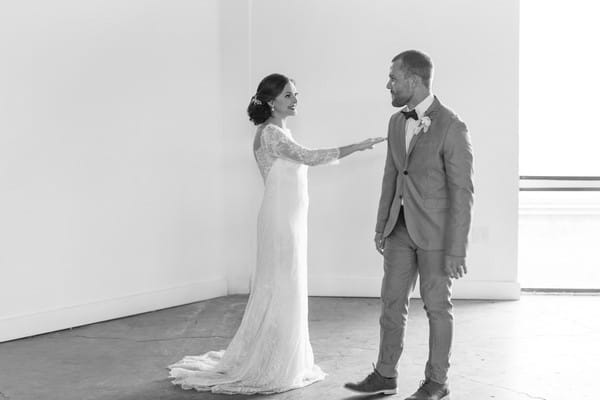 Groom turning to see bride