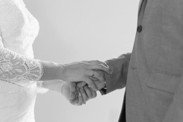 Bride and groom holding hands