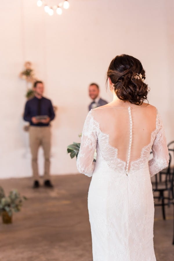 Bride walking into wedding ceremony at East Crossing