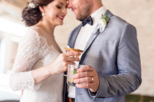 Bride and groom with cocktails