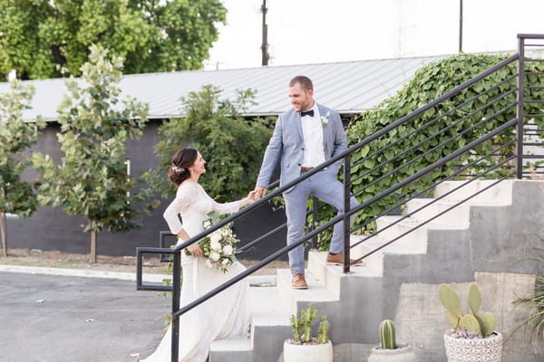 Bride and groom on steps of East Crossing