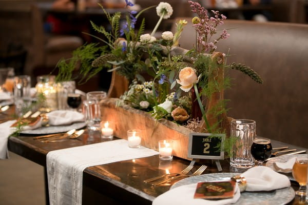 Floral wedding table centrepiece in wooden planter