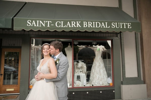 Bride and groom in front of Saint-Clark Bridal Suite