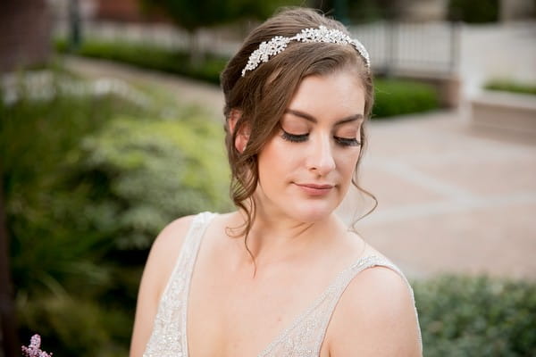 Bride with updo wearing hairpiece