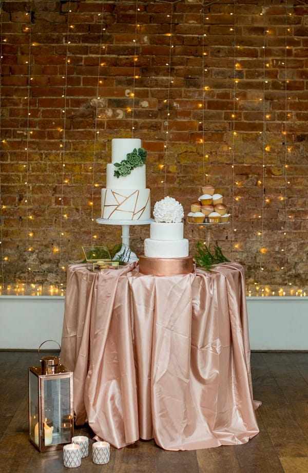 Wedding cake table with copper tablecloth