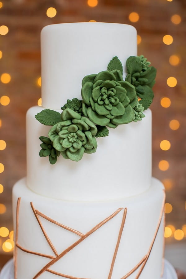 Wedding cake with succulent and geometric copper detail