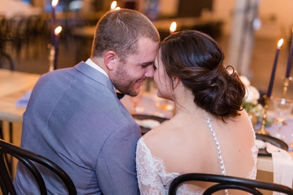 Bride and groom touching heads